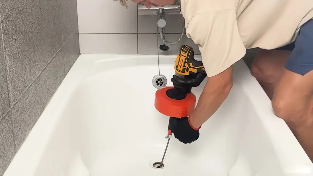 Plumber installing plumbing for an accessible walk-in shower