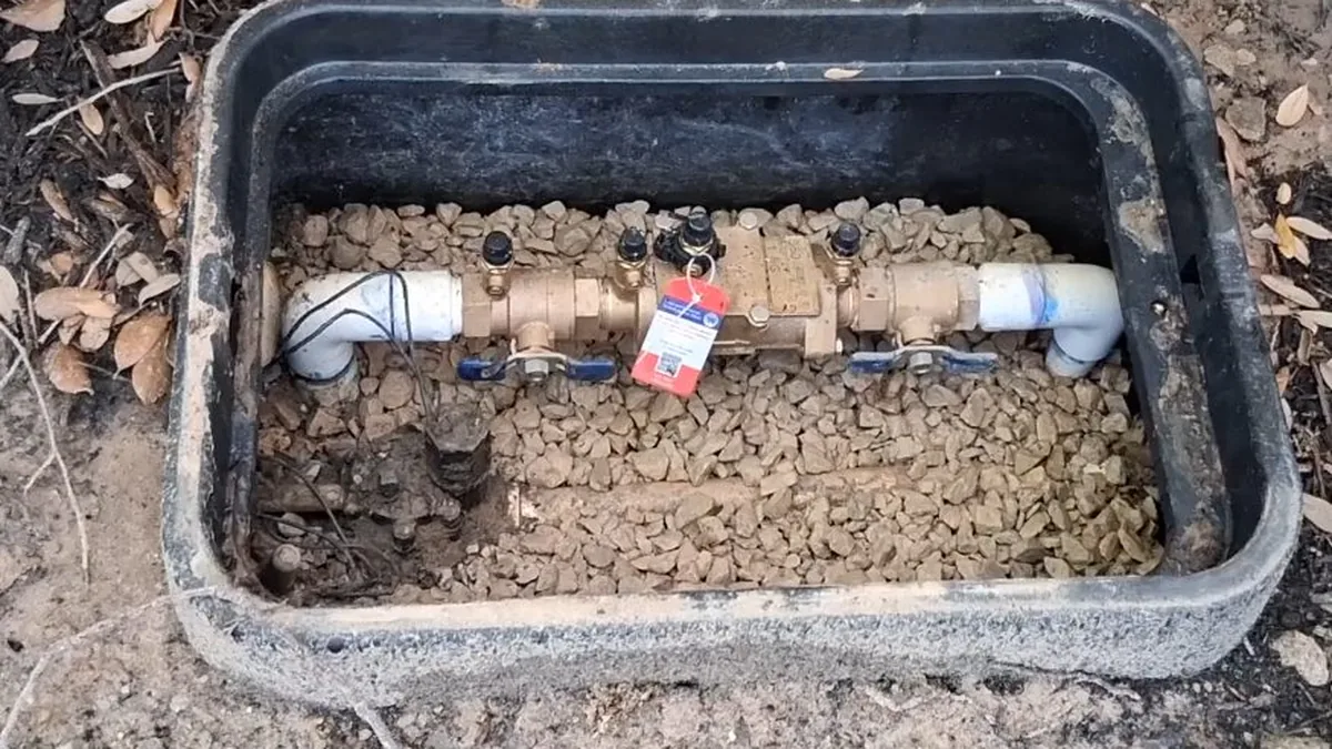 Plumber replacing a backflow prevention assembly near Naco