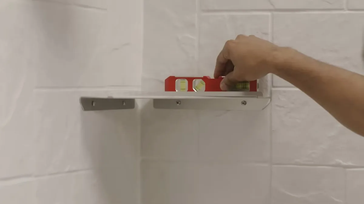 Plumber installing shower plumbing during a bathroom remodel