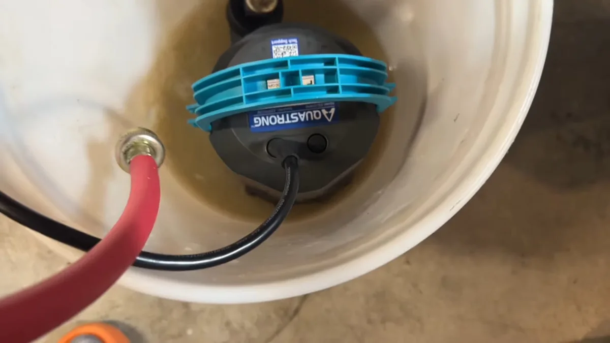 Plumber connecting drain lines to a newly installed garbage disposal