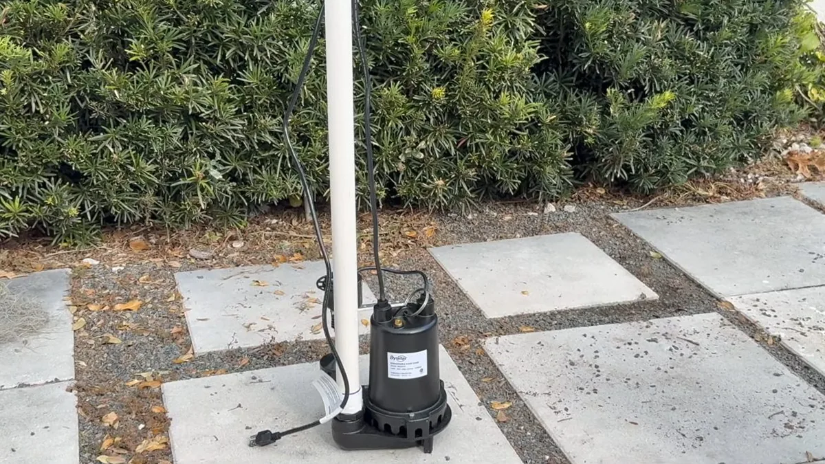 Plumber inspecting pool plumbing equipment for a suspected leak