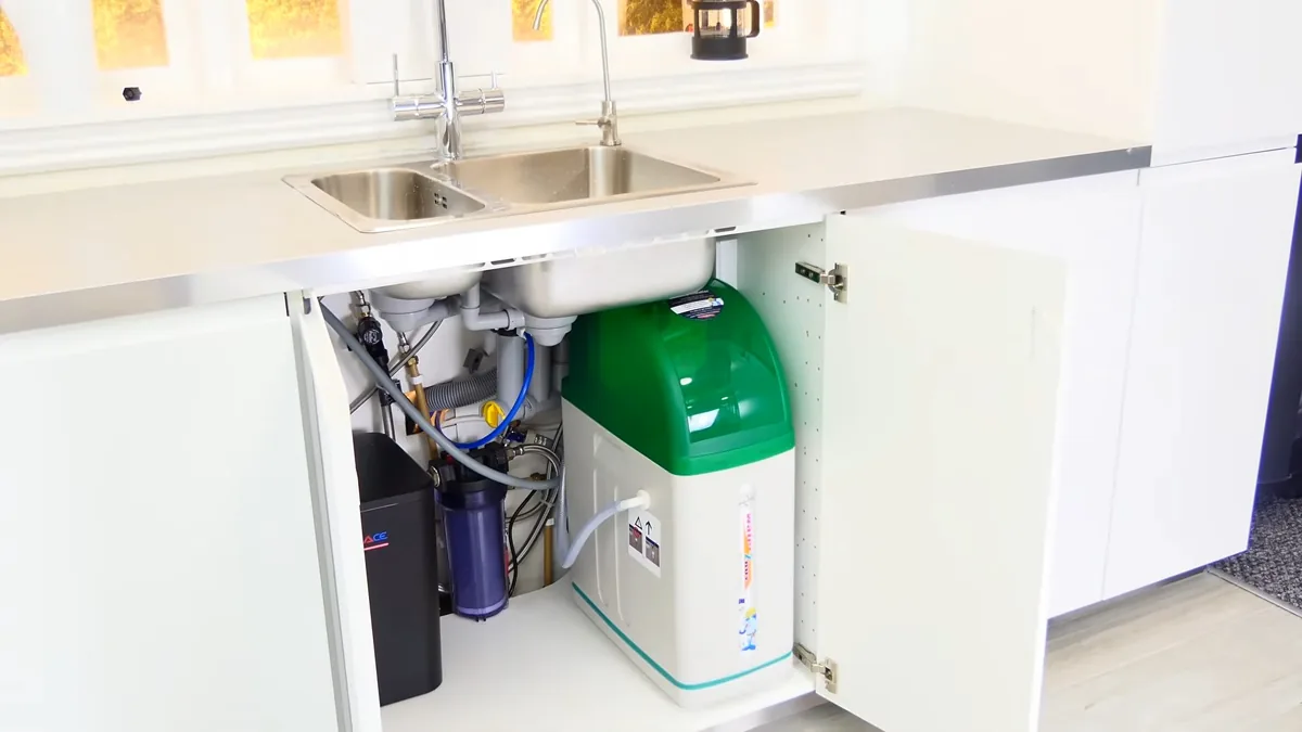 Plumber connecting the storage tank on a reverse osmosis system