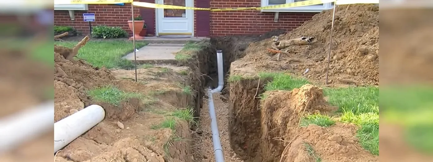 New blue-rated sewer pipe laid in an open trench