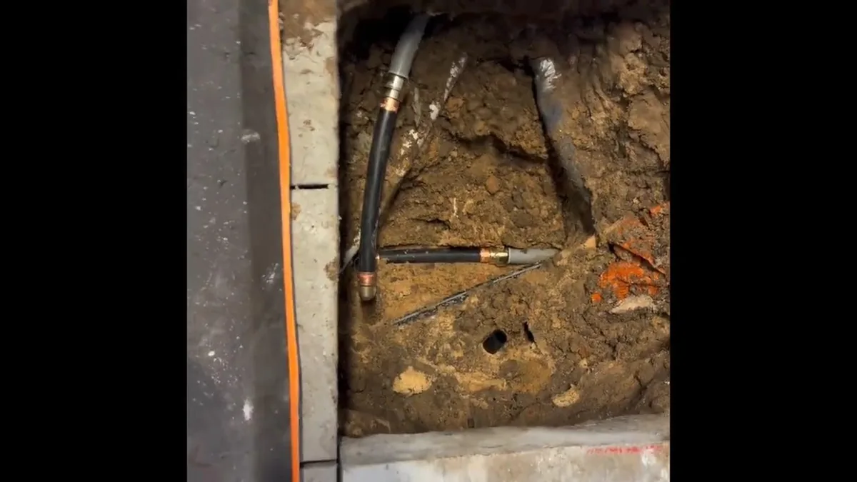 Plumber repairing a damaged sewer line section near Benson