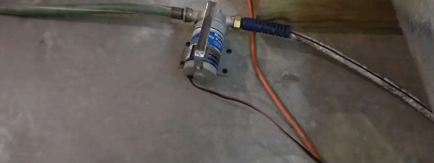 Sump pump basin set into a basement floor ahead of monsoon season
