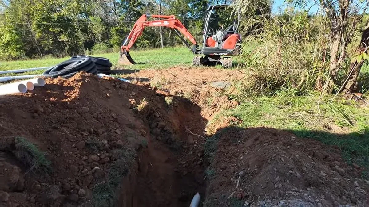 Plumber preparing equipment for a trenchless sewer line replacement